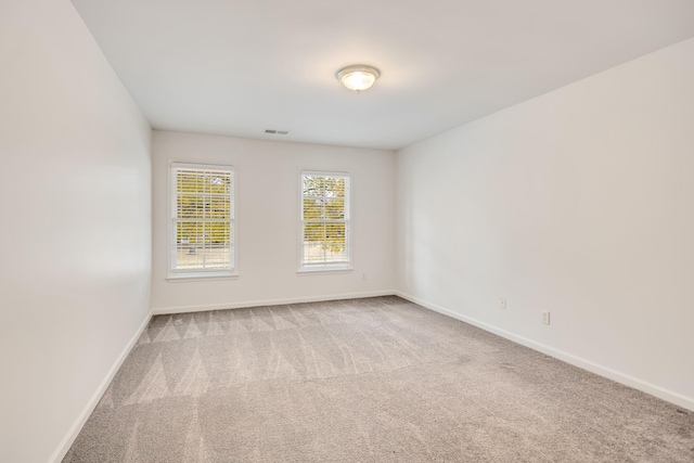 unfurnished room featuring carpet