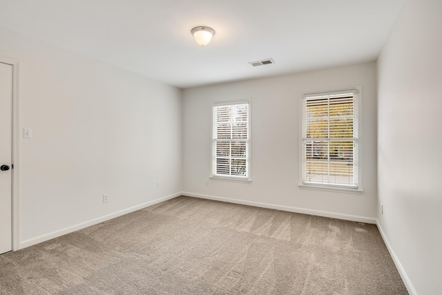 spare room featuring carpet floors