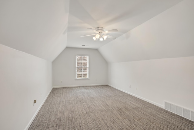 bonus room featuring ceiling fan, carpet floors, and lofted ceiling