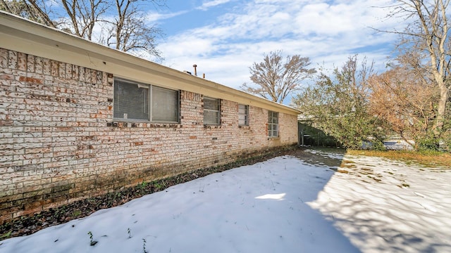 view of snow covered property