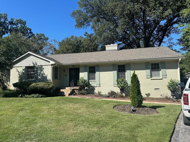 single story home featuring a front lawn