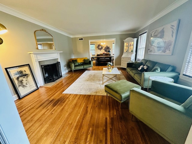 living room featuring crown molding and hardwood / wood-style floors