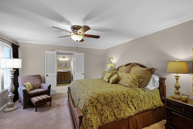 carpeted bedroom featuring ensuite bath, ceiling fan, crown molding, and multiple windows