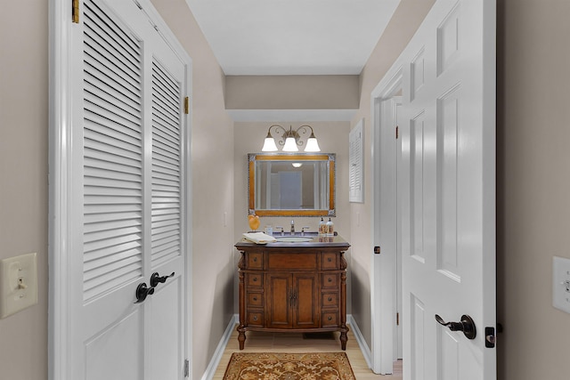 bathroom with vanity and hardwood / wood-style floors