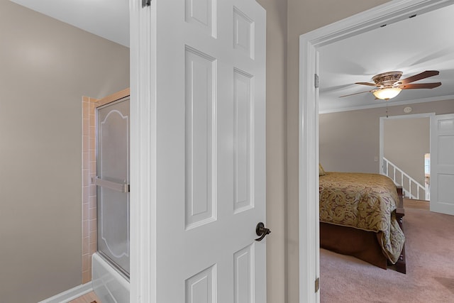 bedroom with ceiling fan, light colored carpet, and ornamental molding