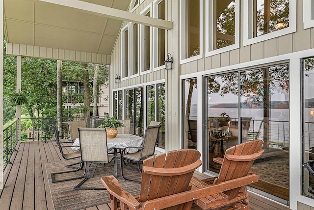 sunroom featuring vaulted ceiling