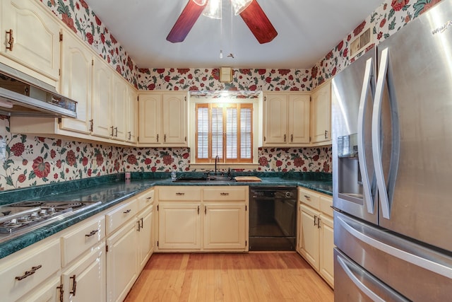 kitchen with ceiling fan, light hardwood / wood-style floors, sink, appliances with stainless steel finishes, and cream cabinetry