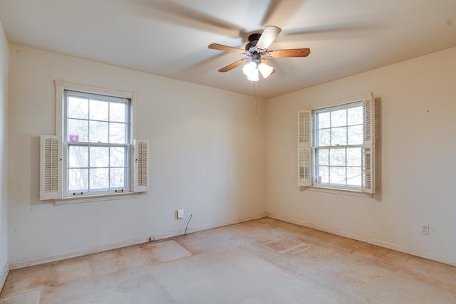 unfurnished room with ceiling fan and a wealth of natural light