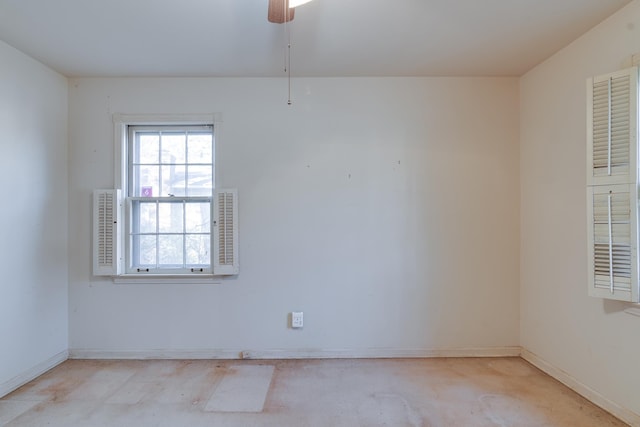 spare room with ceiling fan