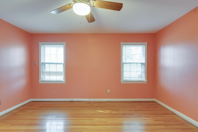 spare room featuring light hardwood / wood-style floors and ceiling fan