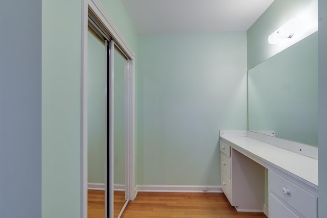 bathroom featuring hardwood / wood-style flooring and vanity