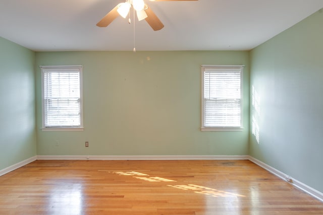 spare room with ceiling fan and light hardwood / wood-style flooring