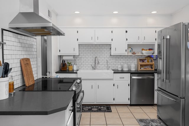 kitchen with sink, white cabinets, island range hood, and stainless steel appliances