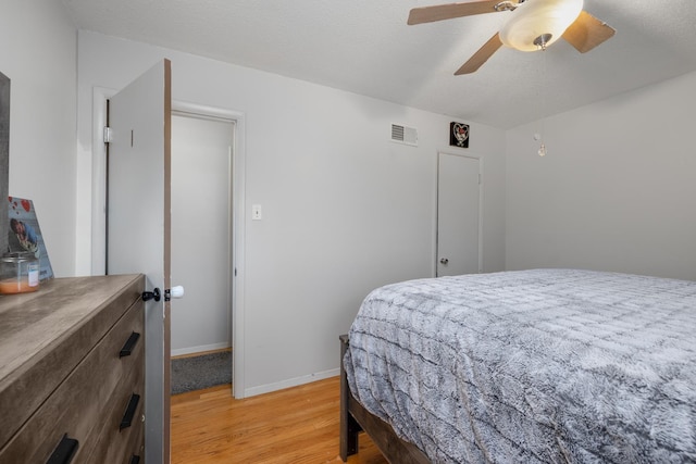 bedroom featuring ceiling fan and light hardwood / wood-style floors