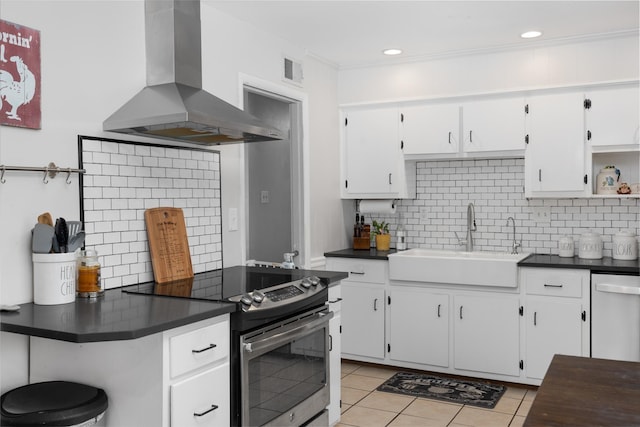 kitchen with stainless steel electric stove, white cabinets, and island range hood