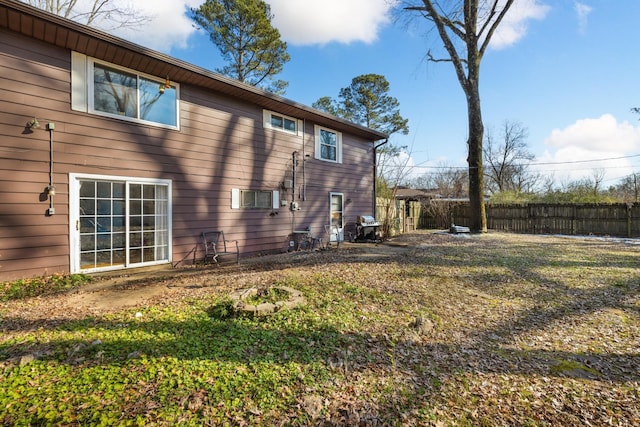 view of side of property with a yard