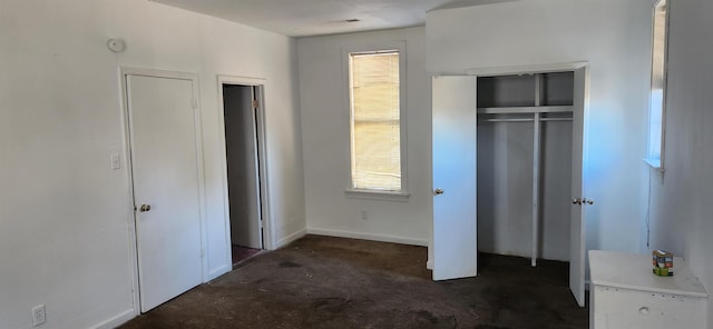 unfurnished bedroom with multiple windows