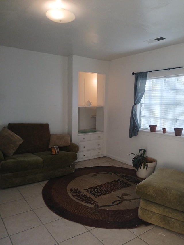 living room with light tile patterned flooring