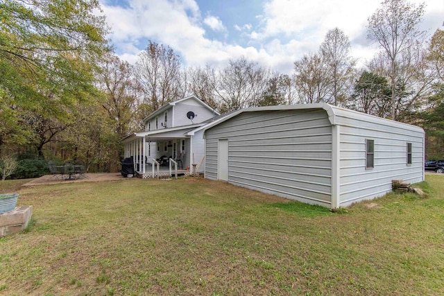 rear view of house featuring a yard