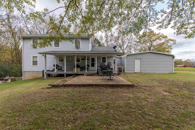 back of house featuring a shed and a yard