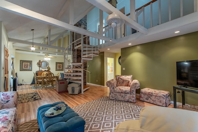 living room with high vaulted ceiling, wood-type flooring, and ceiling fan