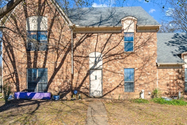 back of house with a yard