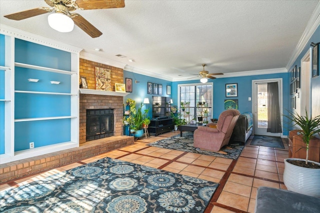 tiled living room with built in shelves, a brick fireplace, a textured ceiling, and ornamental molding