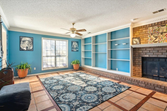 living room with ceiling fan, tile patterned flooring, a brick fireplace, a textured ceiling, and built in shelves