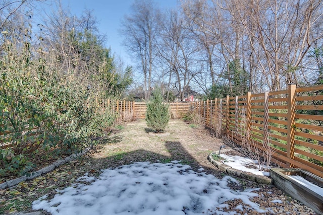 view of yard covered in snow