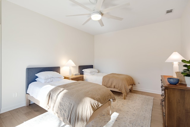 bedroom featuring ceiling fan and light hardwood / wood-style flooring