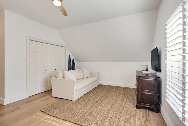 living area featuring ceiling fan, a healthy amount of sunlight, and light hardwood / wood-style flooring