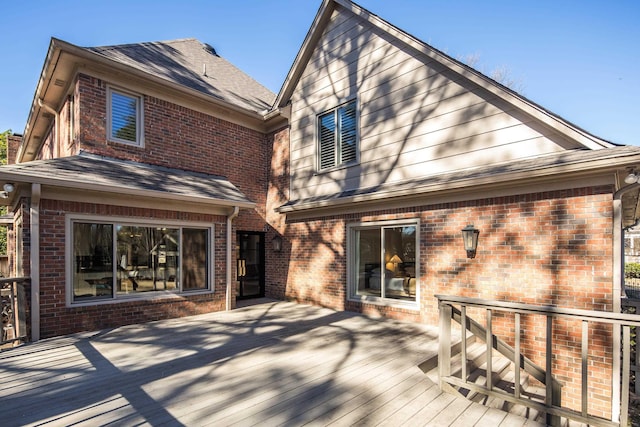 back of house featuring a wooden deck