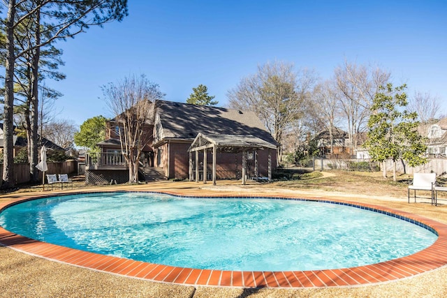 view of swimming pool with a wooden deck and a gazebo