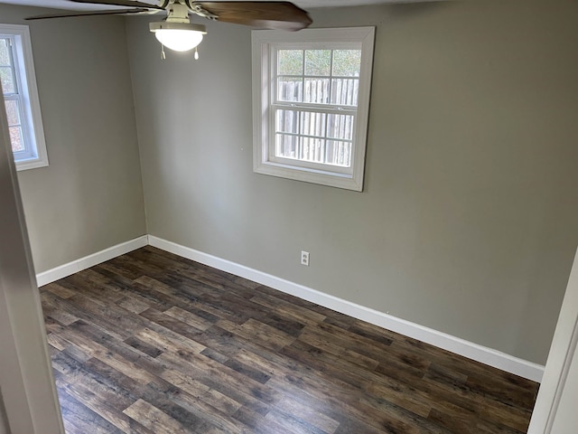 spare room featuring ceiling fan and dark hardwood / wood-style flooring