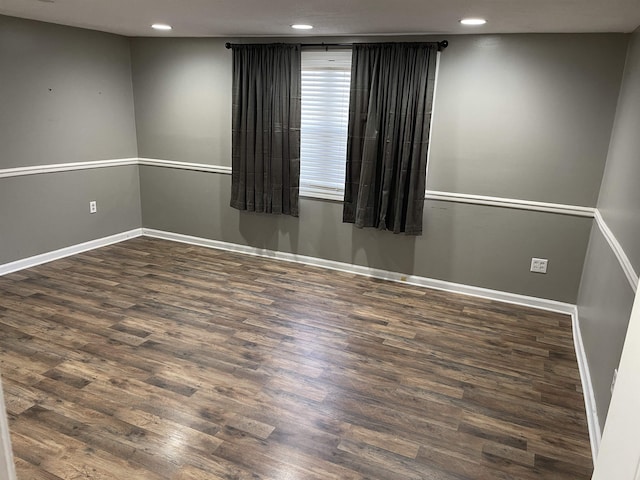 unfurnished room featuring dark hardwood / wood-style floors