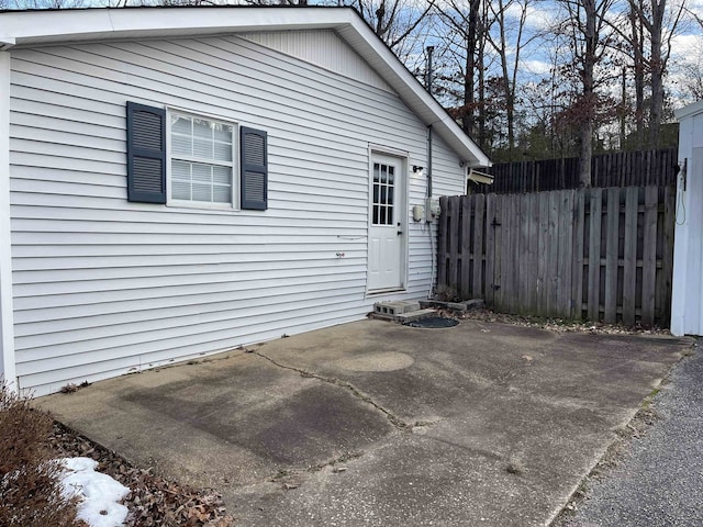 view of side of home with a patio