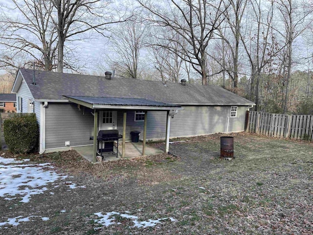 snow covered property featuring a patio area