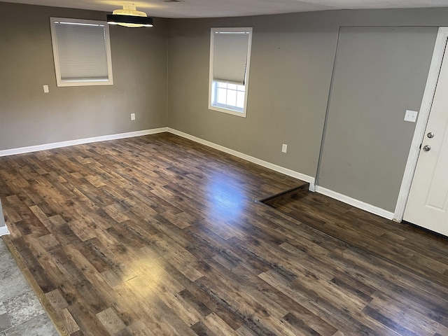 empty room featuring dark hardwood / wood-style floors