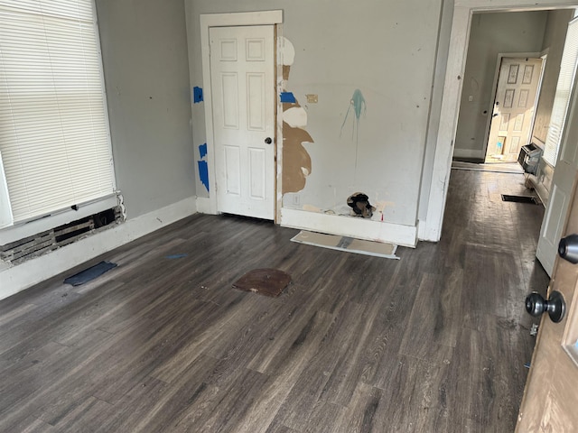 interior space with dark hardwood / wood-style floors