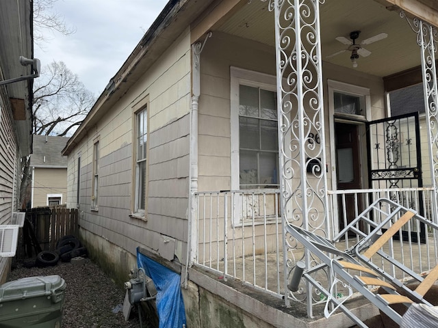 view of side of home with ceiling fan