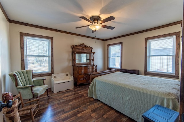 bedroom with ceiling fan, dark wood-type flooring, and crown molding