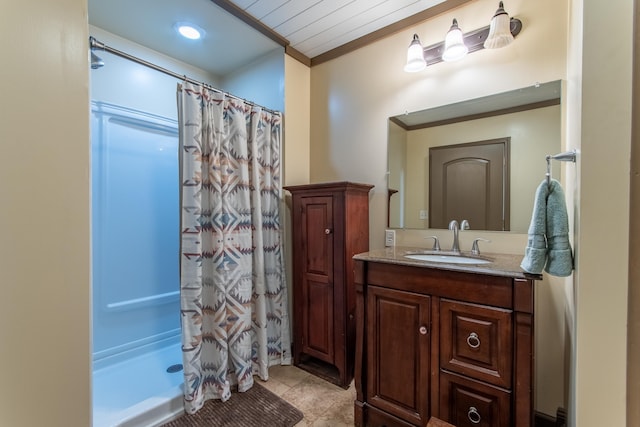 bathroom featuring vanity, a shower with curtain, and crown molding