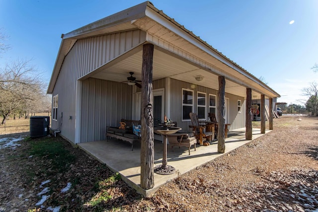 rear view of house with ceiling fan, central AC, and a patio