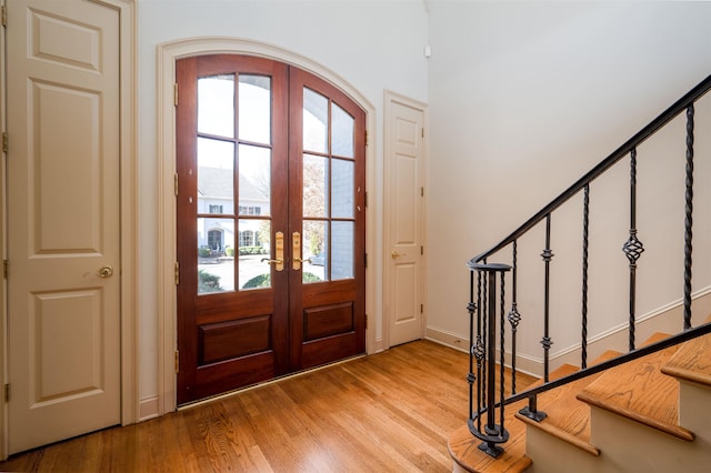 foyer featuring french doors and light wood-type flooring