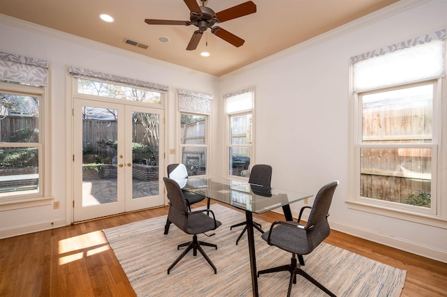 office featuring ceiling fan, hardwood / wood-style floors, ornamental molding, and french doors