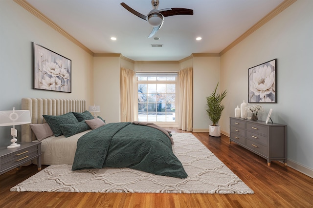 bedroom with ceiling fan, dark hardwood / wood-style flooring, and crown molding