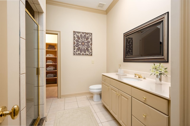 bathroom featuring toilet, a shower with door, tile patterned flooring, crown molding, and vanity