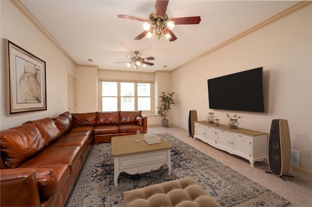 carpeted living room with ceiling fan and ornamental molding