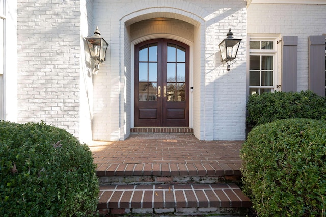 entrance to property featuring french doors