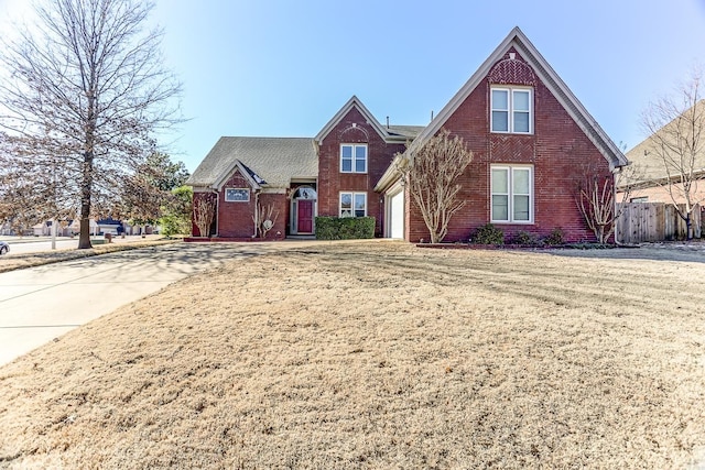 view of front of property featuring a front yard and a garage